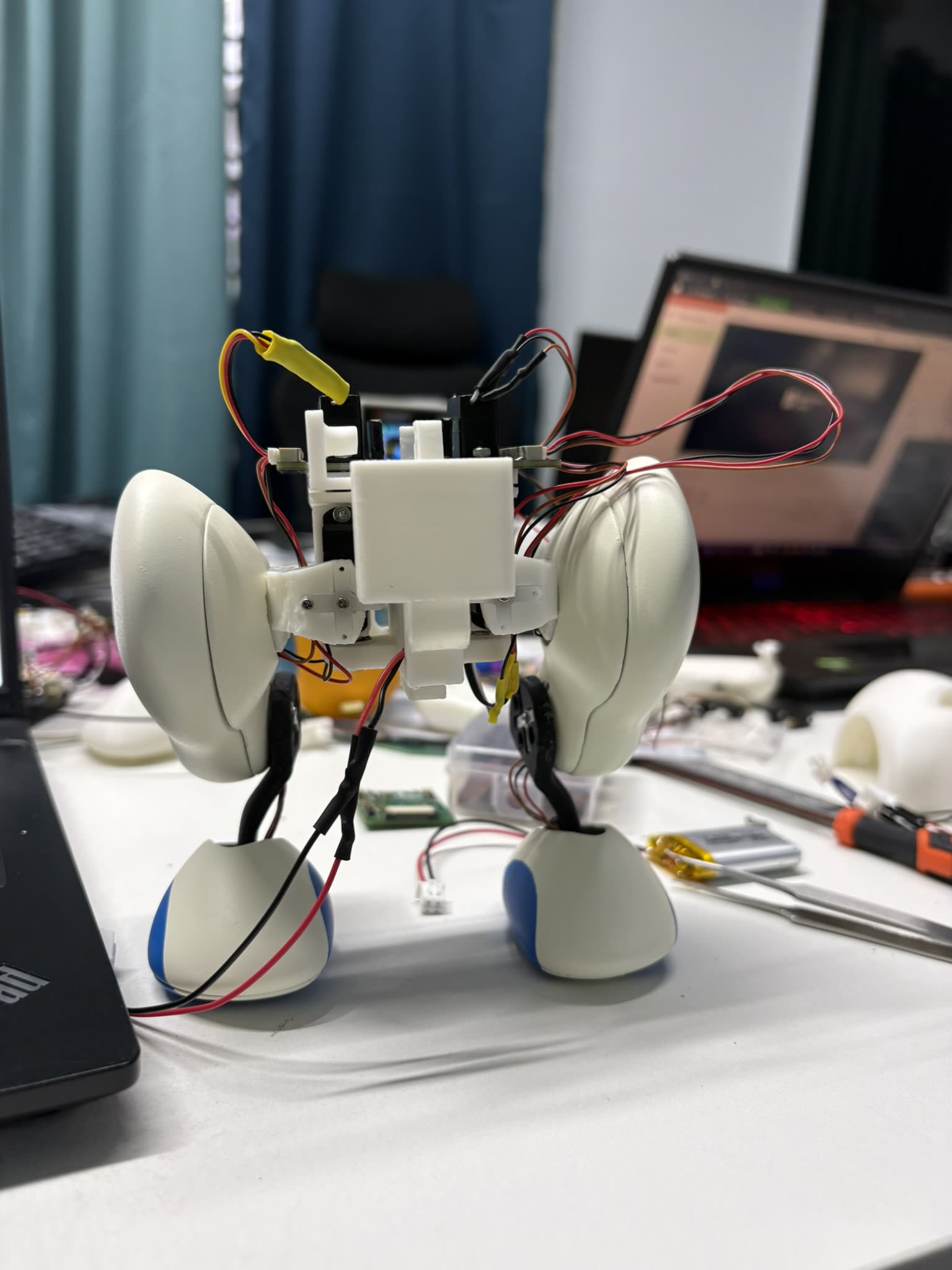 Piko part-assembled, white printed shell and wiring on a desk